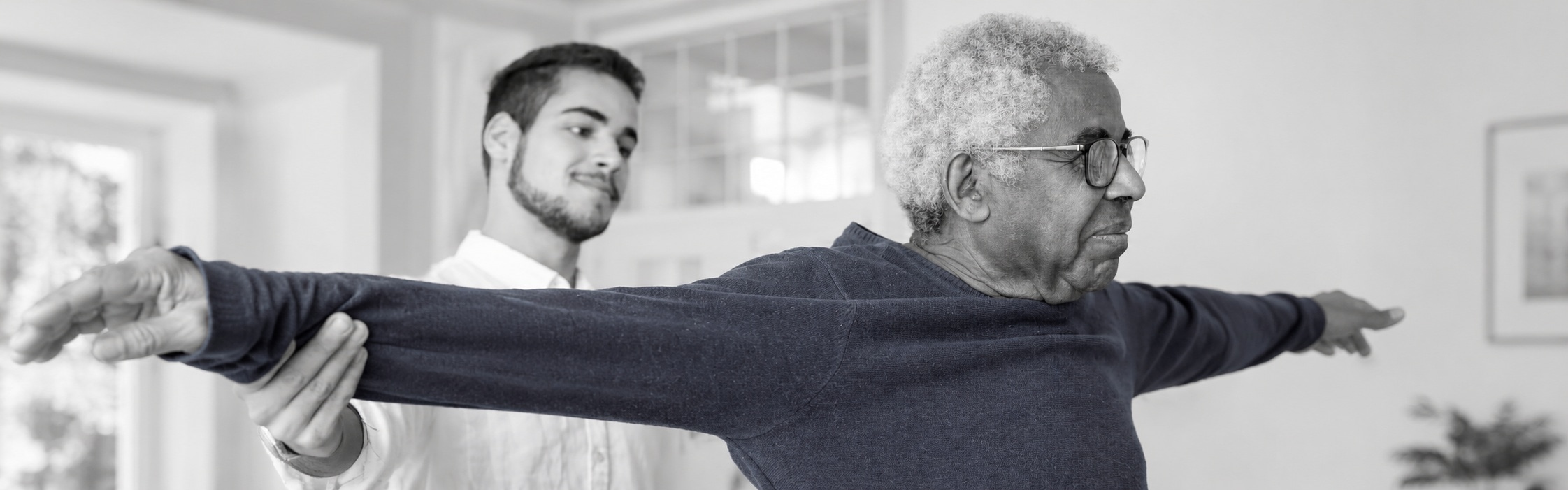 Physiotherapist guiding a client through a movement and mobility exercise at Global Rehabilitation Service